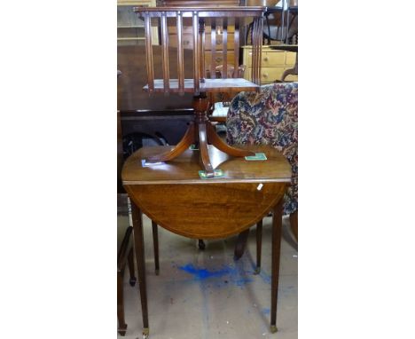 A mahogany bow-end Pembroke table, and a mahogany table-top revolving book rack (2) 