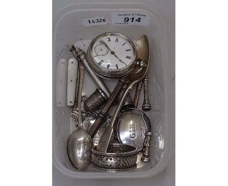 An engine turned silver-cased pocket watch by D J Rix, a silver napkin ring, decanter labels and spoons 