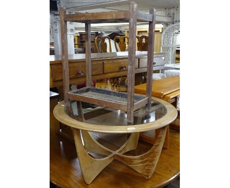 A mid-century G-Plan circular teak coffee table, with glass top, and an oak stick stand 