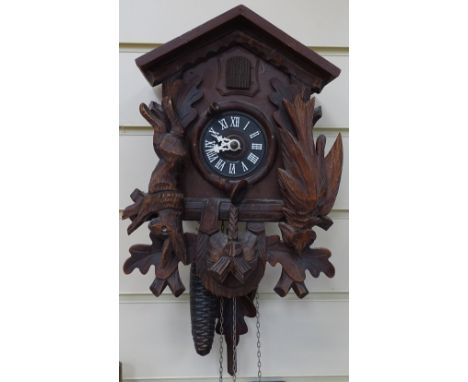 A Black Forest cuckoo clock, height 11" 