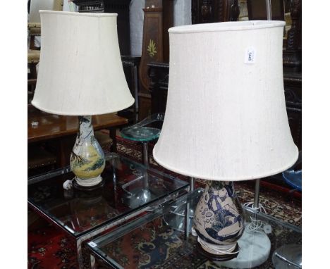 A pair of Asian painted pottery table lamps and shades, from Kuching, Sarawak, dated 28/11/1986, height including shade 94cm,