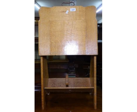 A 1920s light oak magazine stand, H80cm 