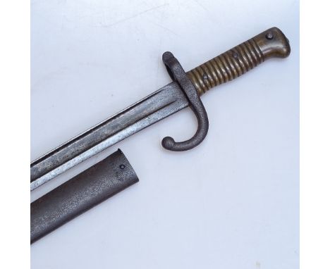 A 19th century French sword bayonet with brass handle, original metal scabbard, overall length 71cm 