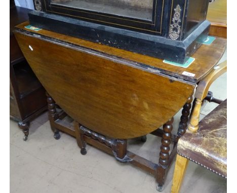 An Antique oak gateleg table on bobbin turned legs, W92cm 