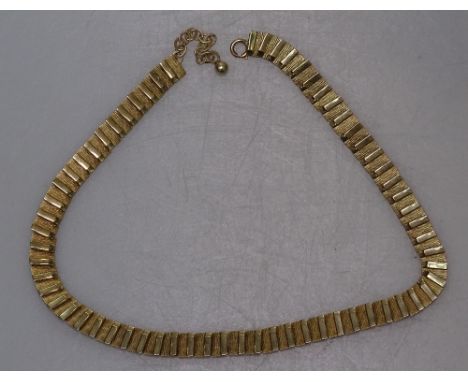 A stylised 9ct gold panel necklace, 19.8g 