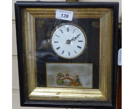 An ebonised wall clock with Oriental scene, 9" across 