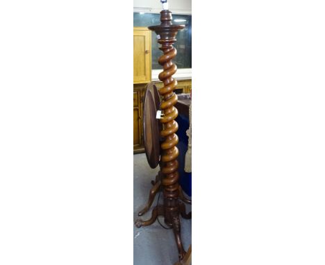A Victorian mahogany barley twist standard lamp, on carved tripod legs, height not including fitting 152cm 