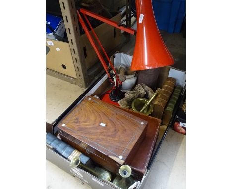 A small suitcase, books, an anglepoise lamp, pestles and mortars, bookends etc 
