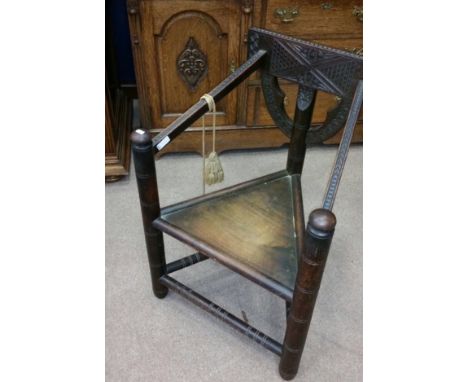 INTERESTING MID-19TH CENTURY WOODTURNERS LIGHT OAK CHAIR 
the notch carved top rail, back support and sloping arm rests, with