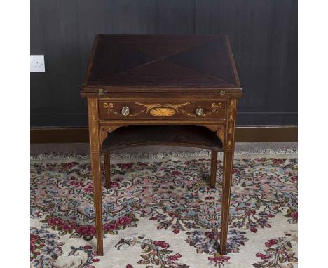 EDWARDIAN MAHOGANY 'SHERATON REVIVAL' ENVELOPE CARD TABLE 
with an attractively inlaid frieze drawers, on square tapered legs