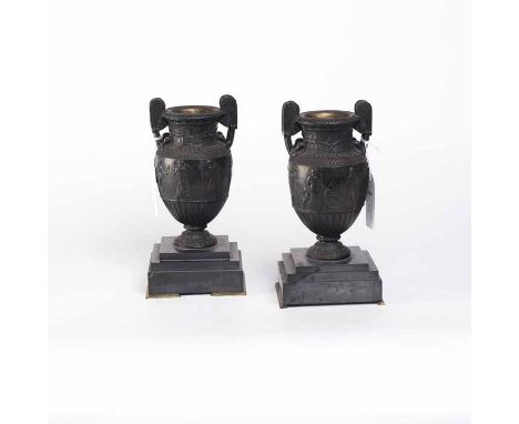 PAIR OF VICTORIAN BRONZE DOUBLE-HANDLED GARNITURE VASES
cast with a central band of classical figures in low relief, on a ste