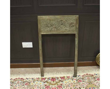 THOMAS JEKYLL BRASS FIRE SURROUND
the rectangular panel with circular floral and butterfly motifs, 91cm high, 53.5cm wide 