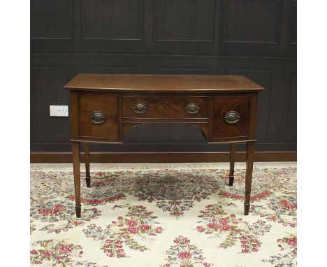 SMALL MAHOGANY BOW-FRONT SIDEBOARD OF GEORGE III DESIGN 
the central frieze drawer flanked by two deep drawers to each side, 