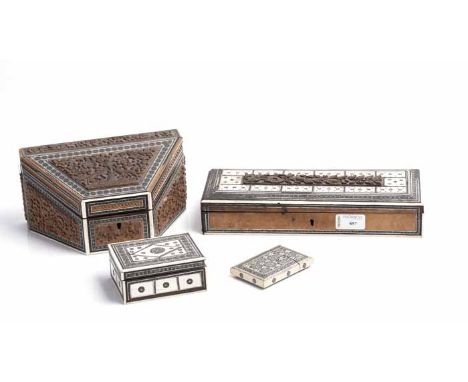 THREE CARVED SANDELWOOD BOXES
each inlaid with bone and mother of pearl; also a similar calling card case (4)