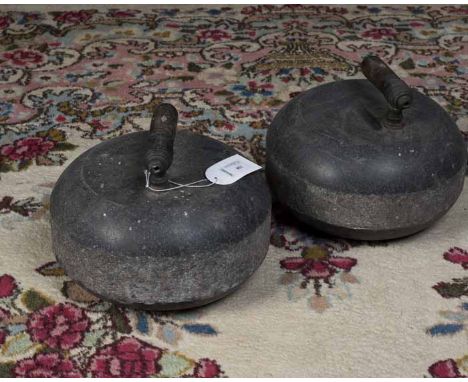 PAIR OF GRANITE CURLING STONES
each handle with mother of pearl inlay, 24cm diameter 