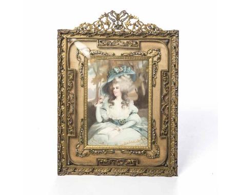 EDWARDIAN GILT METAL PHOTOGRAPH FRAME
of rectangular form with pierced metal pediment, with cast acanthus and floral designs 