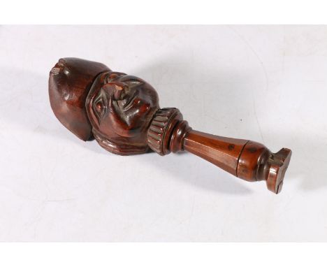 Antique carved treen nutcrack, the finial modelled as the bust of a gentleman, 15cm tall. 
