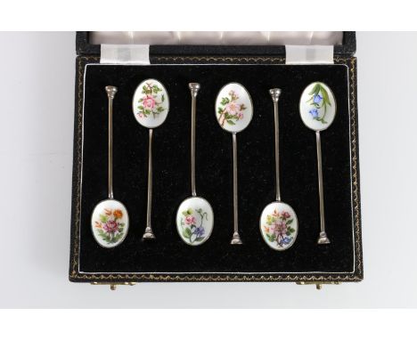 Set of six Elizabeth II silver and enamel coffee spoons by Henry Clifford Davis, Birmingham, 1957, cased. 