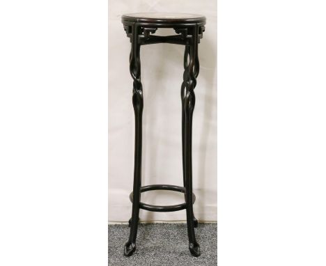 Oriental hardwood jardiniere stand, the circular top with inset marble panel above decorative frieze raised on twisted splaye