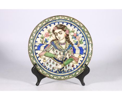 Early ceramic dish, the centre decorated with female figure in floral dress, 22cm dia.