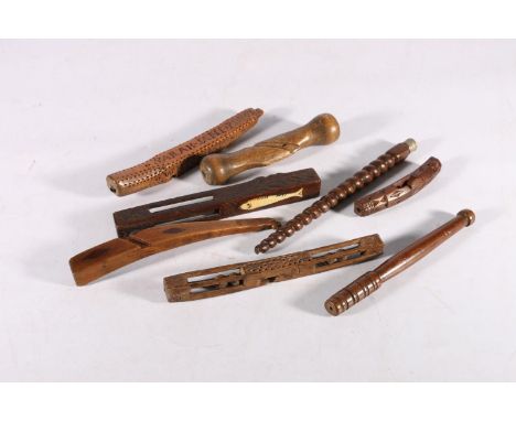 Seven mid to late 19th century shuttles and other tools, some carved and named, one with an inlaid bone fish.&nbsp; (7) 
