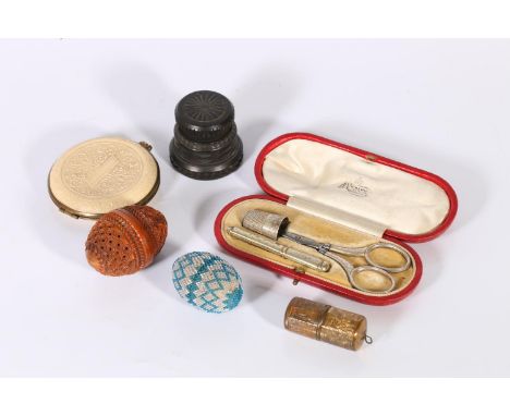 J C Vickery of Rent Street etui, leather, cased, a carved nut rosin holder, a metal thimble holder and a beaded egg containin