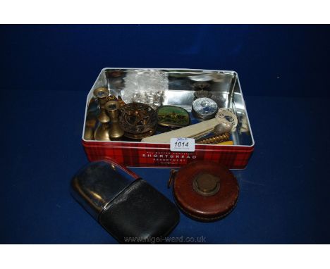 A Chesterman 33ft tape measure, six small plated name plate holders in the form of goblets, reproduction Compass, leather and