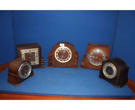 Five deco Mantle Clocks, four Oak cased and one Smiths Bakelite cased clock, two being of square form and the other three wit