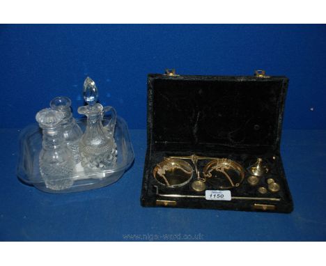 A cased set of Indian Brass Scales, and two small matching Bottles, one with stopper, and small glass Vinegar bottle