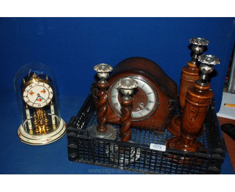 A quantity of miscellaneous items including two pairs of wooden candlesticks, wooden cased mantle clock and an Anniversary cl