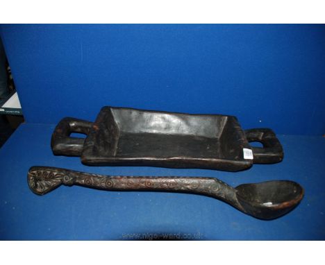 A wooden African Serving Tray and Ladle