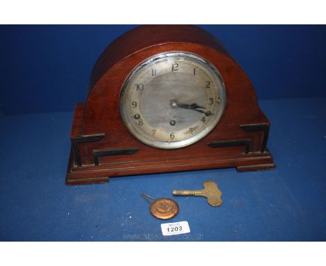 A good deco Mahogany cased Mantle Clock by Garrard Clocks Ltd., England, having applied ebony detail to the front, alloy face