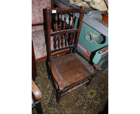 A 19th c. Oak and Ash Clissett style Commode Chair having spindle moulded back supports (some damage to centre rail), standin