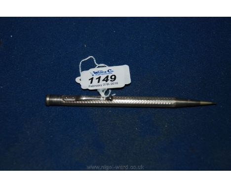 A Silver propelling Pencil with engine turned decoration 