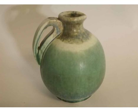 Ruskin W Howson Taylor green formed ewer with shaped handle, impressed mark to  base, 23cms tall 