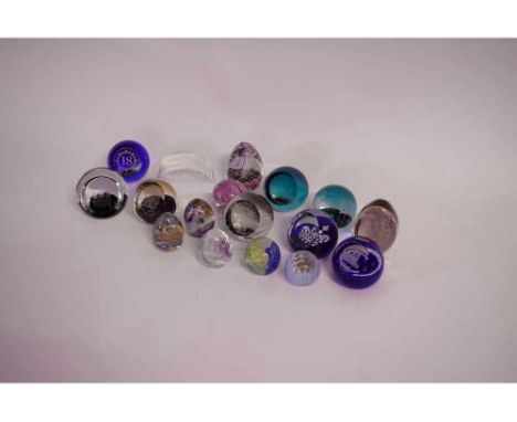 Seventeen assorted paperweights to include Caithness, further Royal commemorative  paperweights in varying sizes and forms (1