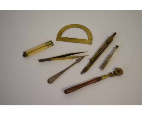 Box containing mixed drawing instruments to include a protractor, a four-fold bone rule,  compass etc (7)