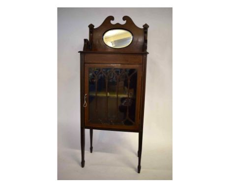 Edwardian inlaid mahogany small display cabinet with mirrored pediment to top, Gothic  tracery to a single door, single shelf