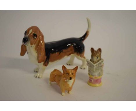 Group comprising a Beswick model of a beagle, 20cms long, Beswick Corgi, 8cms long  and a Beswick Beatrix Potter figure, "Tai