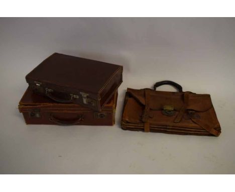 Two small rexine stitched attache cases, one monogrammed MWH, together with a  further vintage leather small case with straps