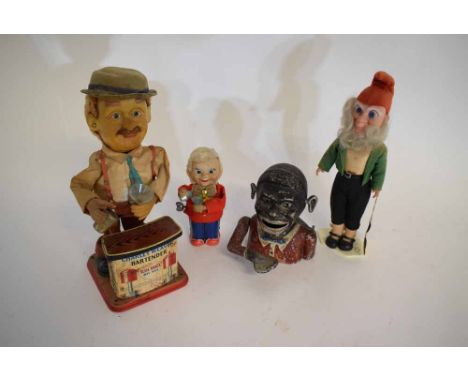 Vintage tin plate wind-up model of a waiter with a red jacket and bow tie, together with a  further Charley Weaver bartender,
