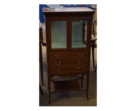 Edwardian mahogany and satinwood inlaid display case with two glazed doors and lined  interior over three full width drawers 