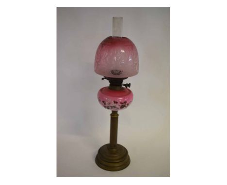 Victorian brass reeded column oil lamp with circular stepped base and a cranberry floral  overlaid font, and etched cranberry