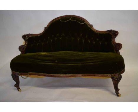 Edwardian walnut small proportioned cottage sofa with green Dralon upholstered seat  and buttoned back with heavily carved sc