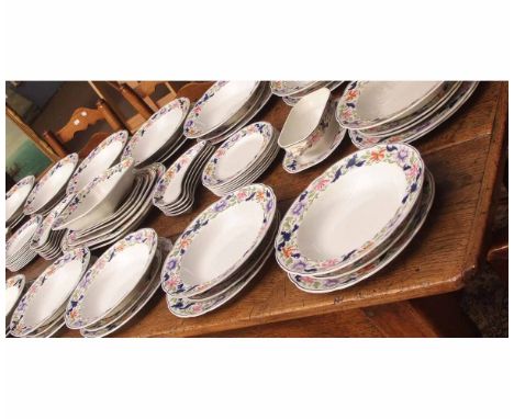 An extensive Spode dinner service with polychrome design of trailing flowers, late 19th/early 20th century including 18 dinne
