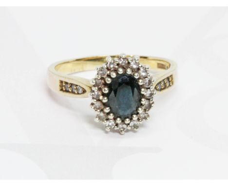 A hallmarked 9ct gold diamond and sapphire cluster ring, gross weight 3.6g, size N.  