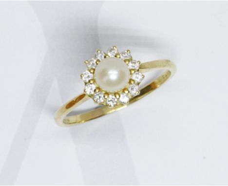 A pearl and diamond cluster ring, the round cluster measuring approximately 10mm in diameter, hallmarked 18ct gold, sponsor '