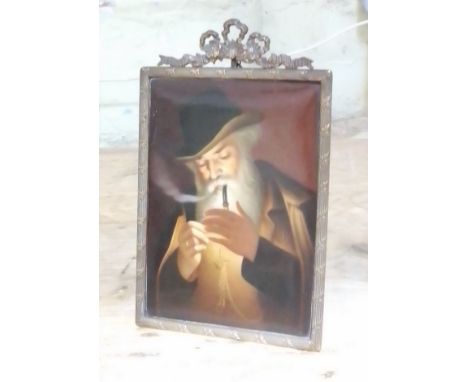 A continental porcelain plaque, hand painting portrait depicting an old man smoking a pipe, gilt brass frame 14cm x 23cm.  