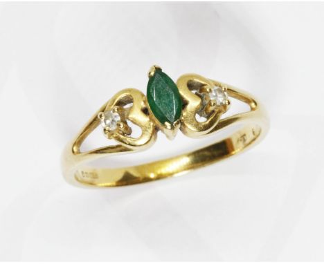 An emerald and diamond ring, 18ct gold import marks, gross weight 3.3g, size P.  Condition - good, general wear only.