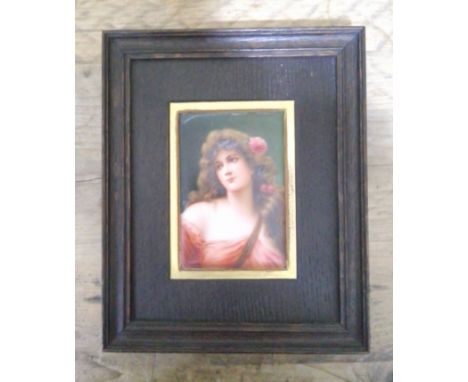 A continental porcelain plaque, circa 1900, hand painted portrait depicting a girl, indistinctly signed, oak frame, 23cm x 28